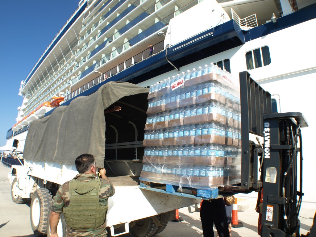 2010-01-22-sl-un-truck-009 Palettes of water being loaded into a UN truck at Labadee