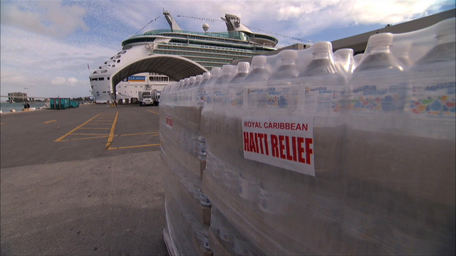 water_shipl-resize Palettes of water being loaded onto Navigator of the Seas